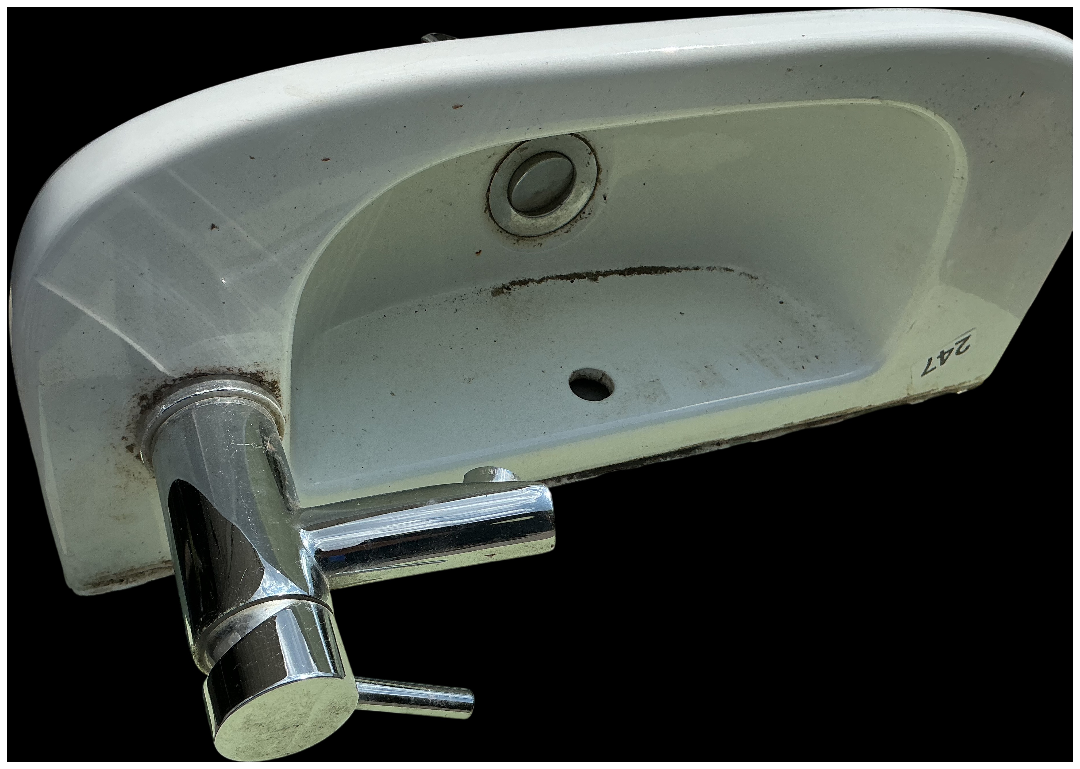 A Contemporary White Ceramic Wall-Mounted Cloakroom Basin with Chrome Mixer Tap