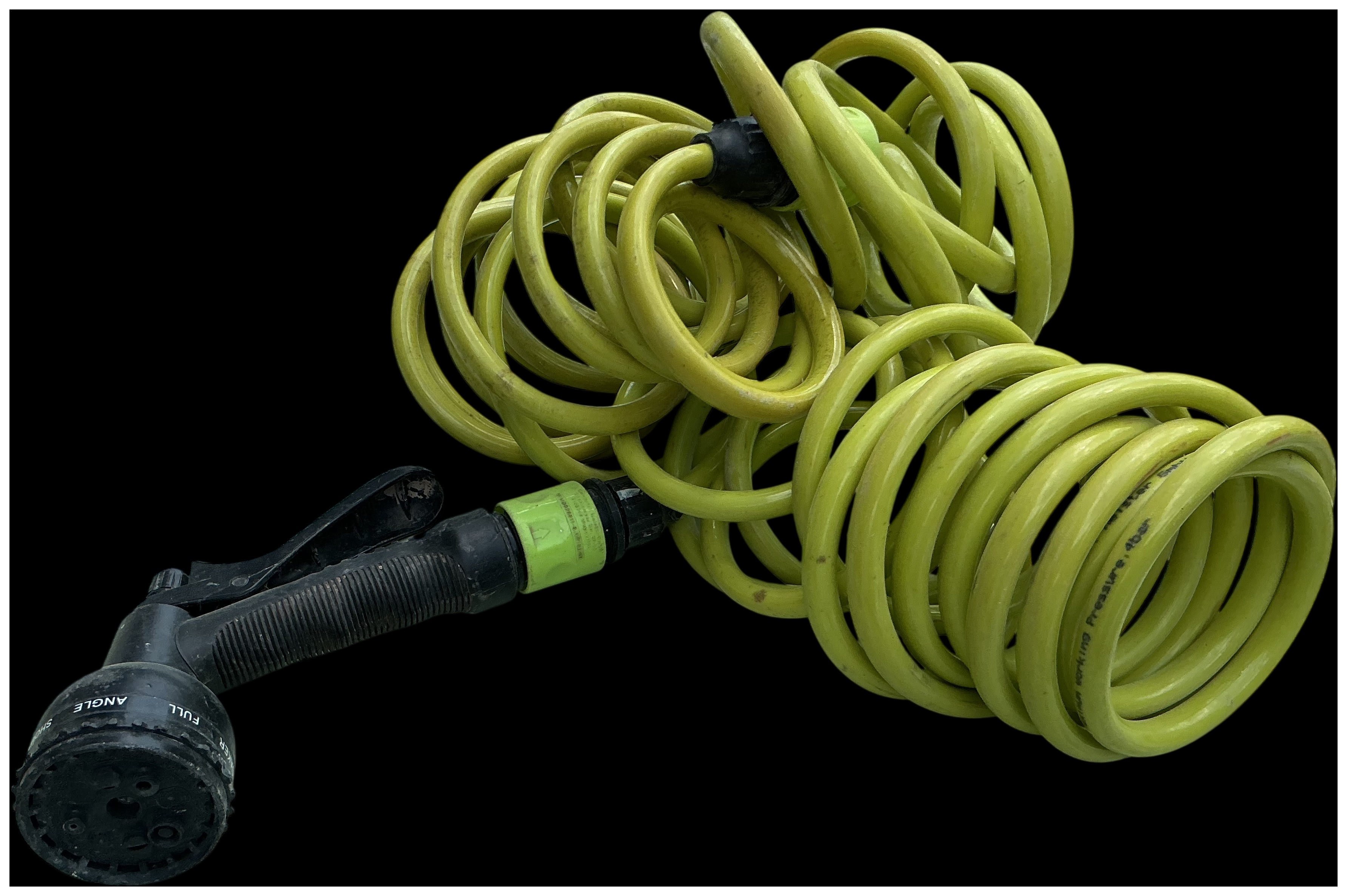 Green coiled garden hose with multi-pattern spray gun nozzle