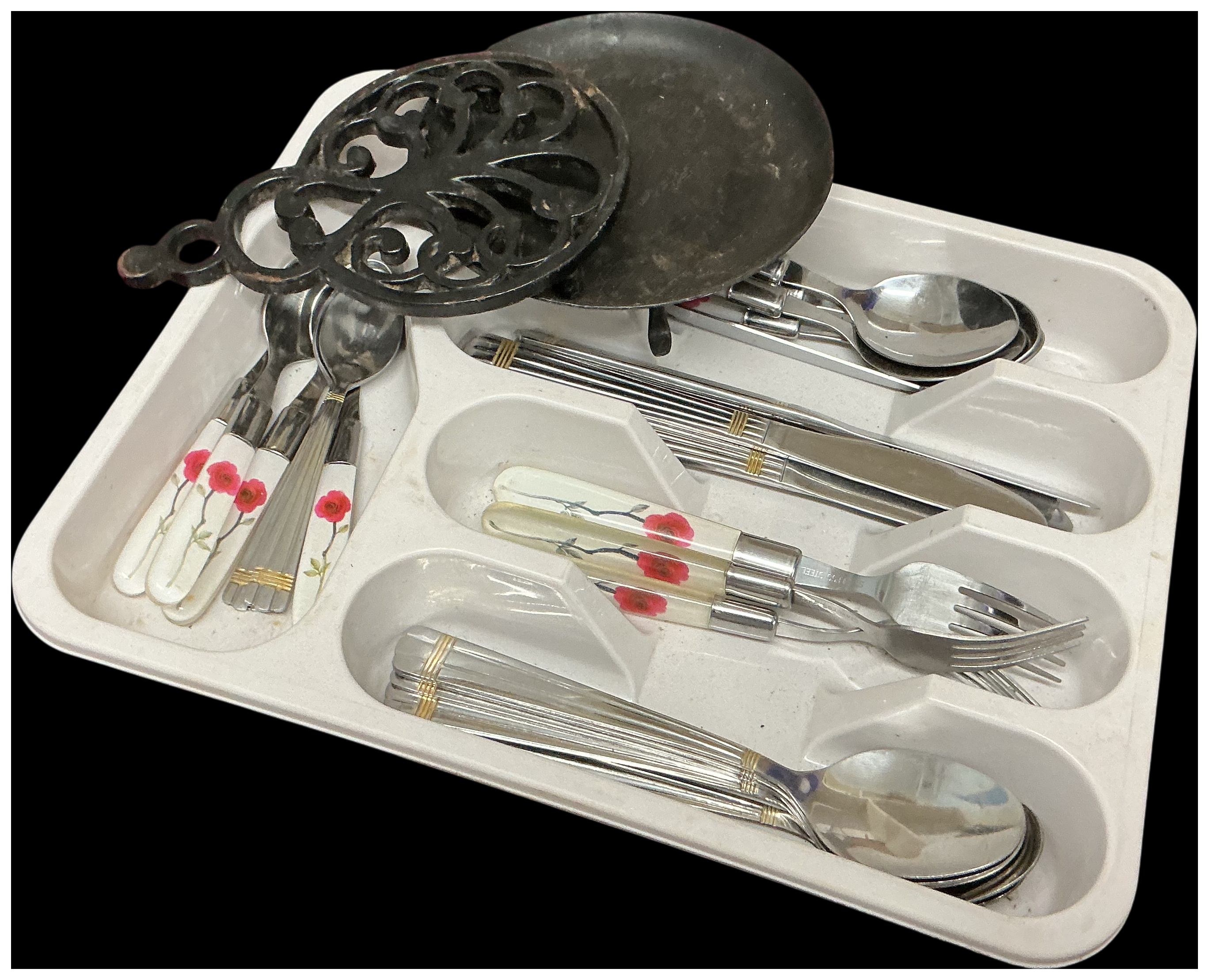 An Assortment of Mixed Flatware and Cast Iron Kitchen Accessories