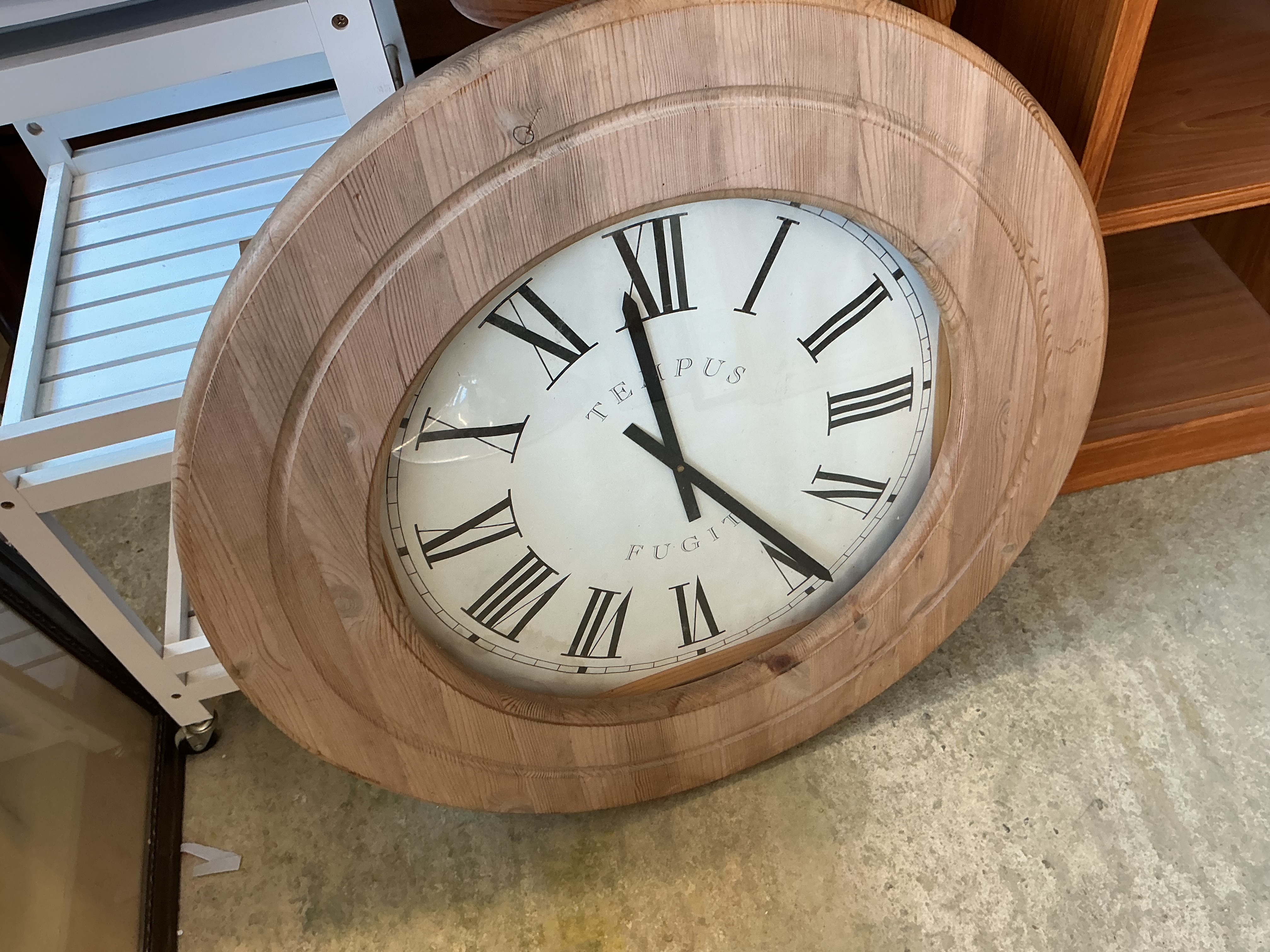 A Large Circular Pine Framed Tempus Fugit Wall Clock