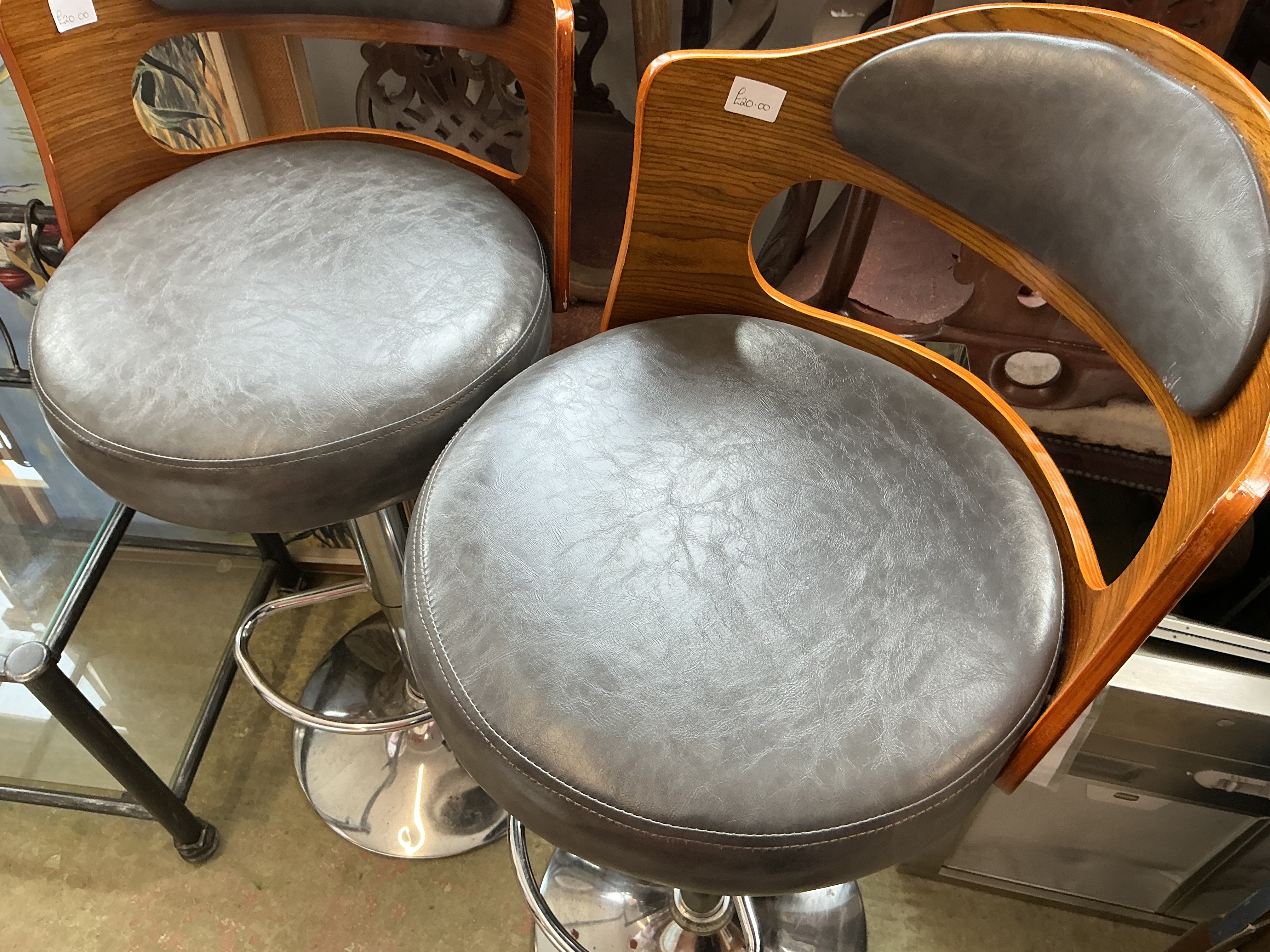 A single of Contemporary Bentwood and Faux Leather Swivel Bar Stool the Mid-Century Modern Style