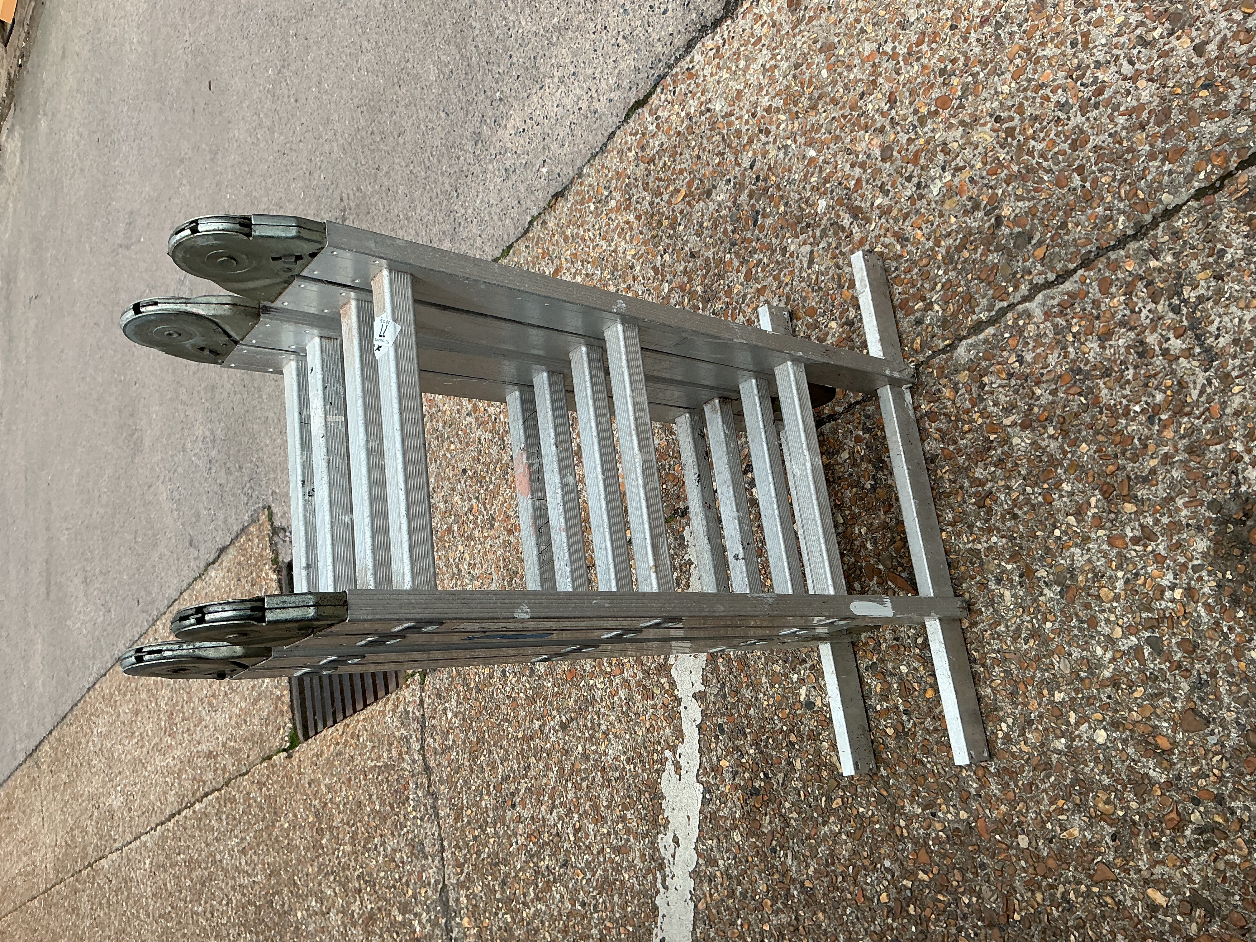 An aluminium multi-purpose articulating folding ladder