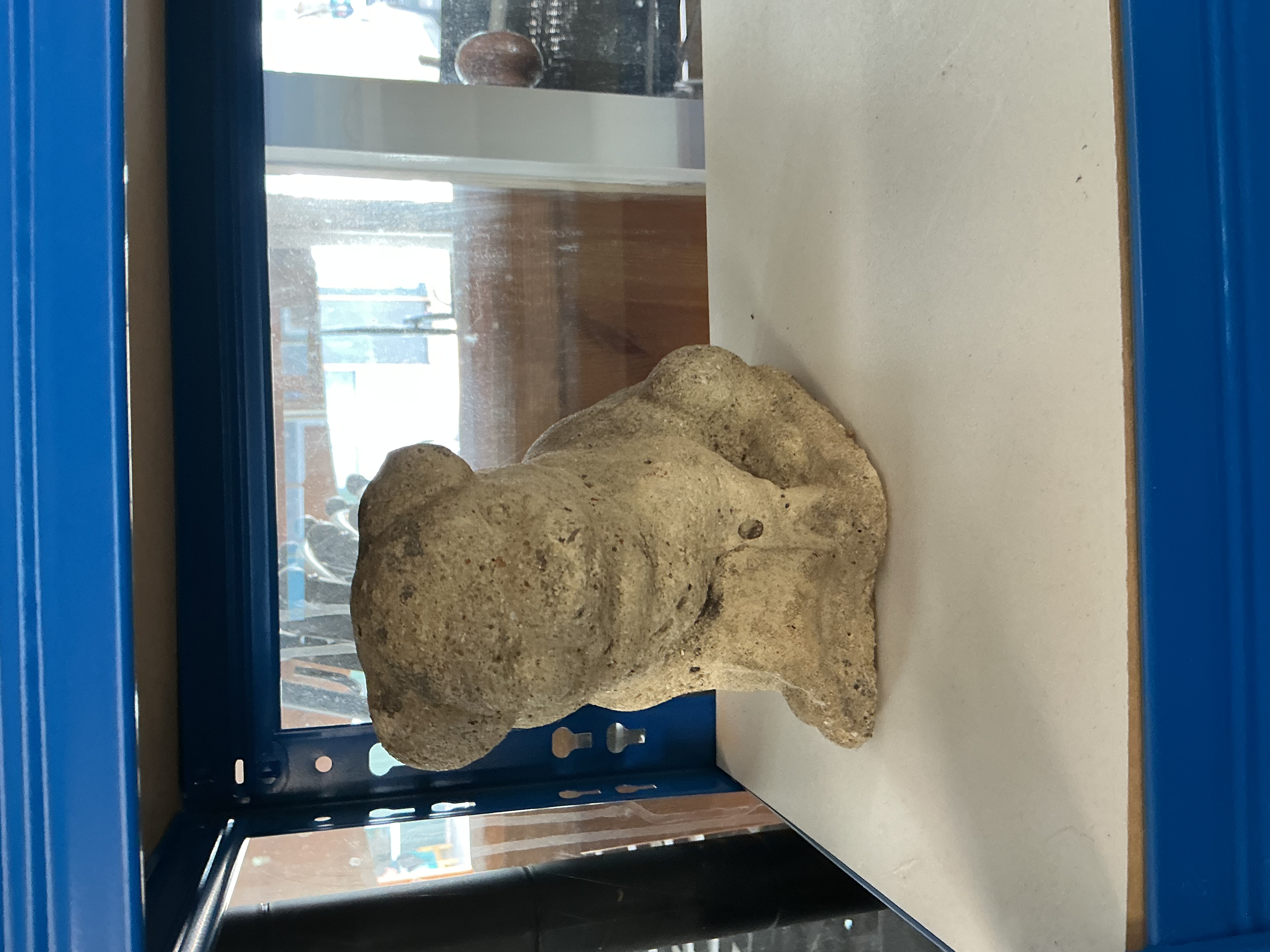 A 20th Century Reconstituted Stone Garden Ornament of a Seated Dog