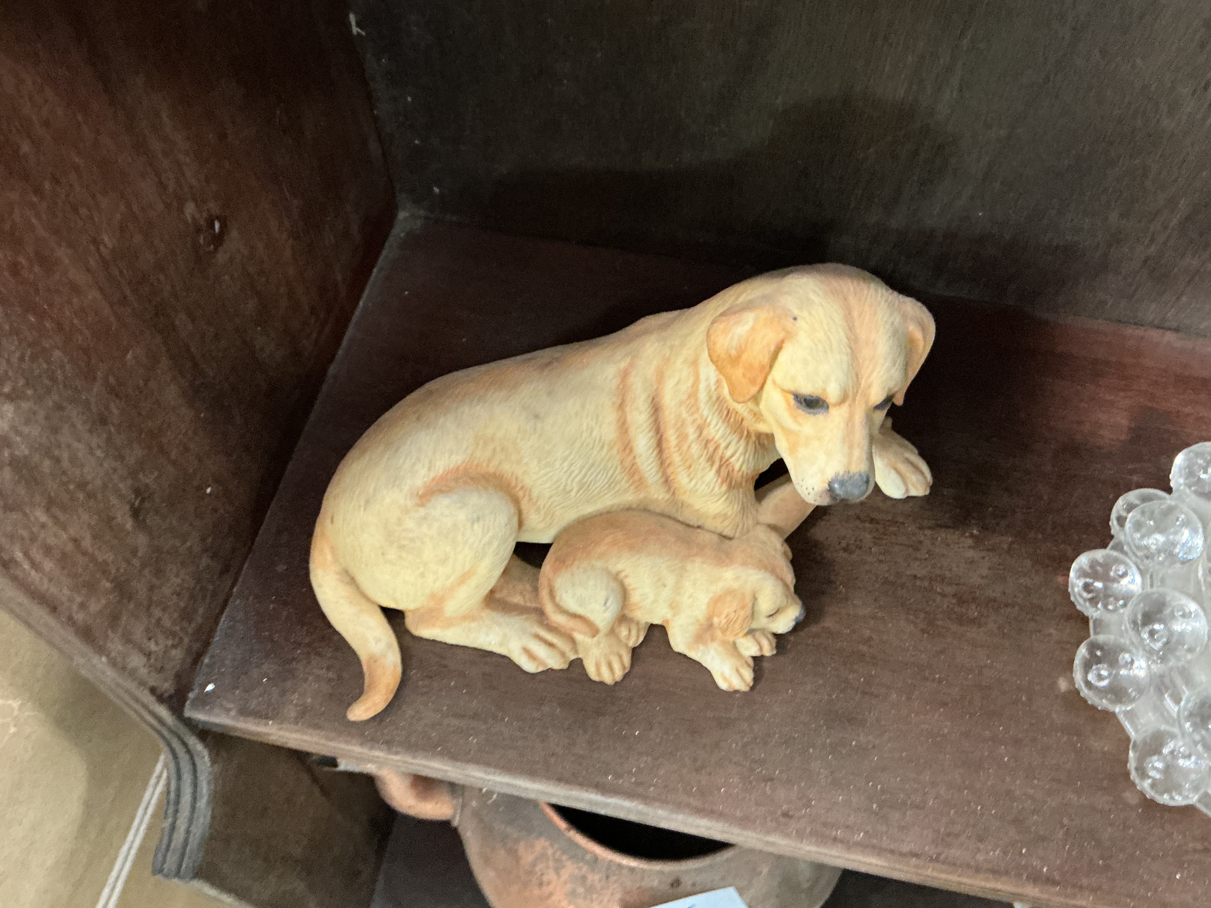A Cold-Cast Resin Figurine of a Golden Retriever and Puppy in the Style of Royal Osborne
