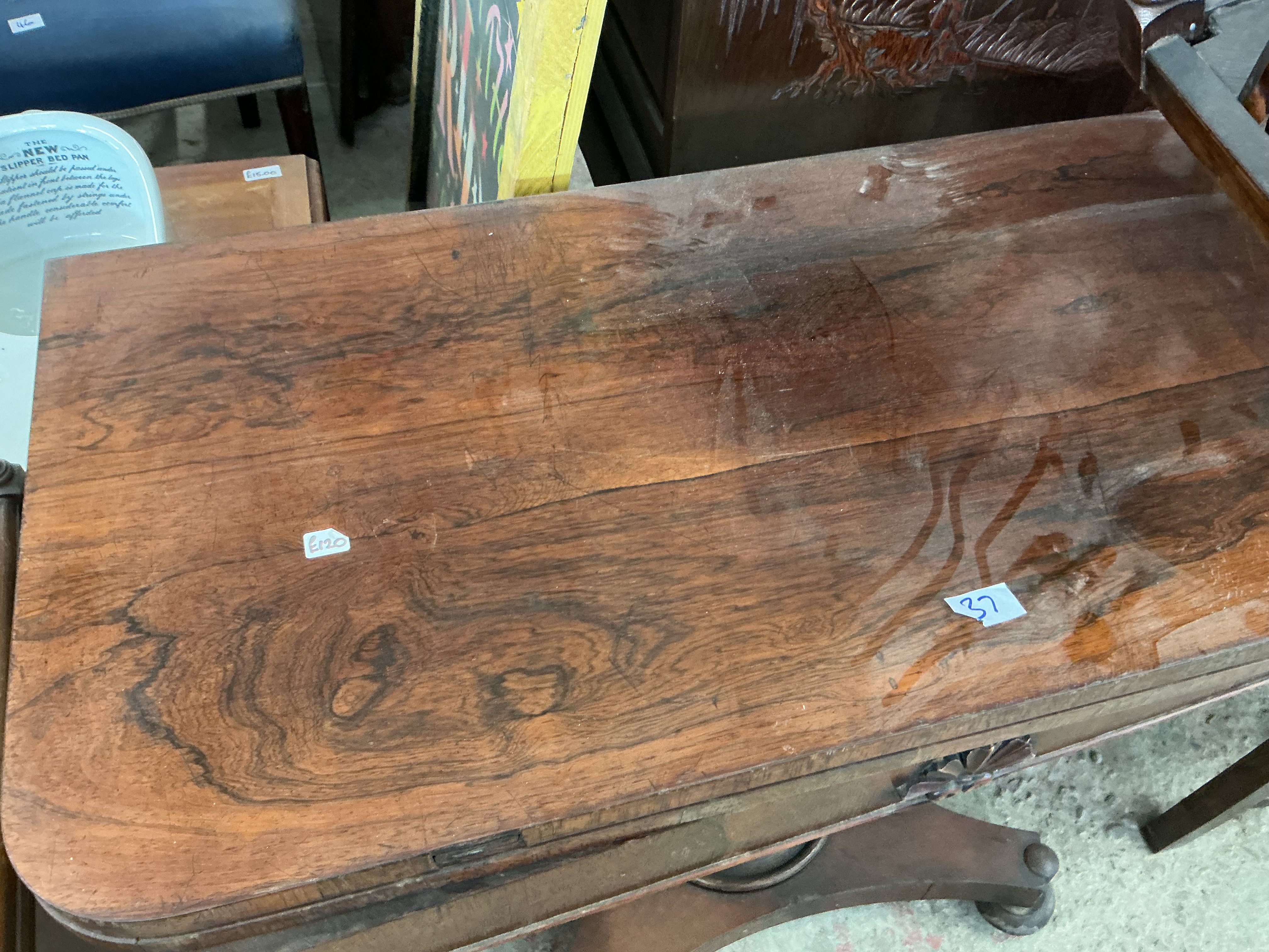 A William IV figured mahogany fold-over tea or card table