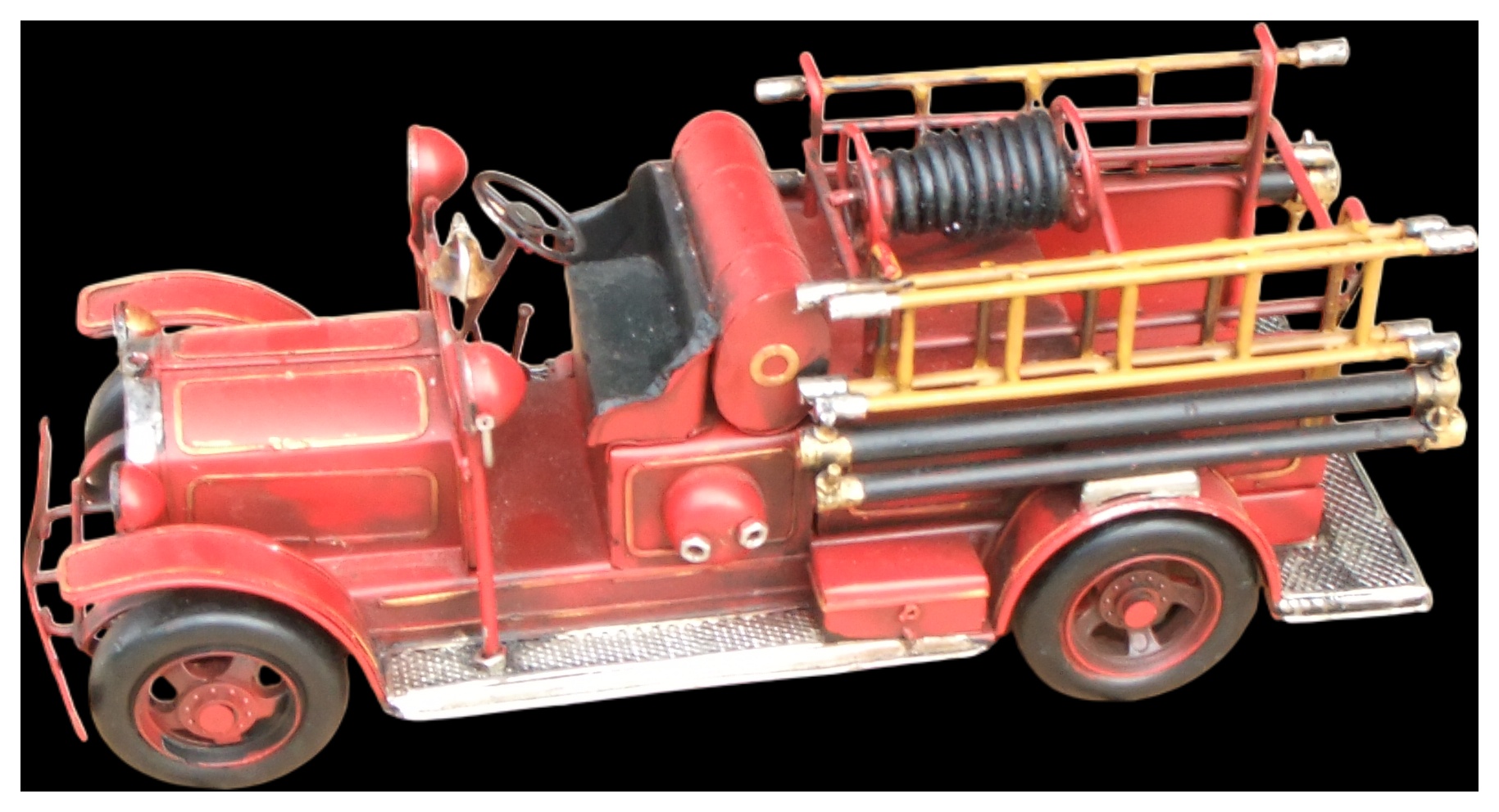 No reserve. A tinplate model of an early 20th-century open-cab fire engine