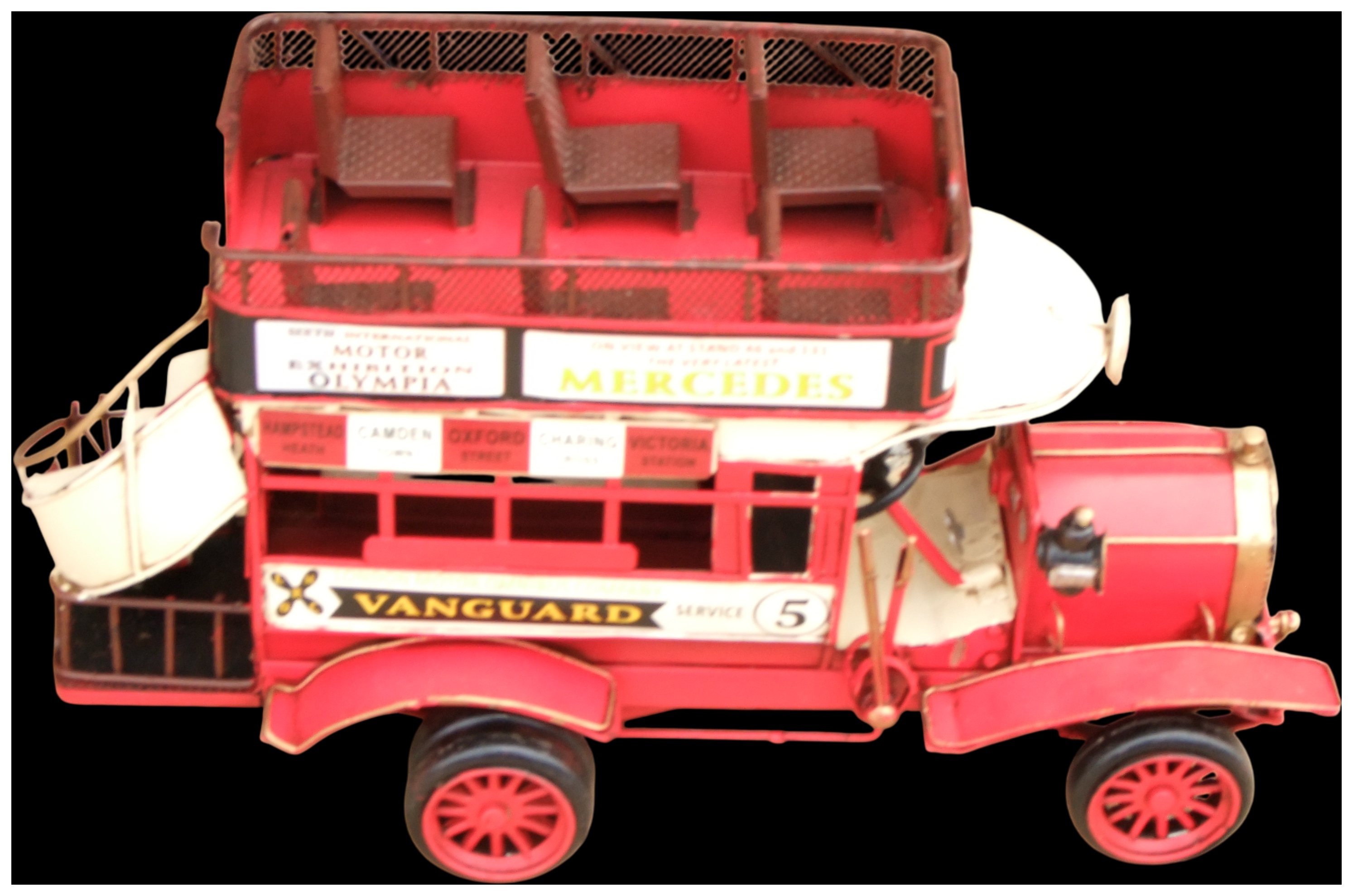 No reserve. A painted tinplate model of a Vanguard London double-decker open-top bus