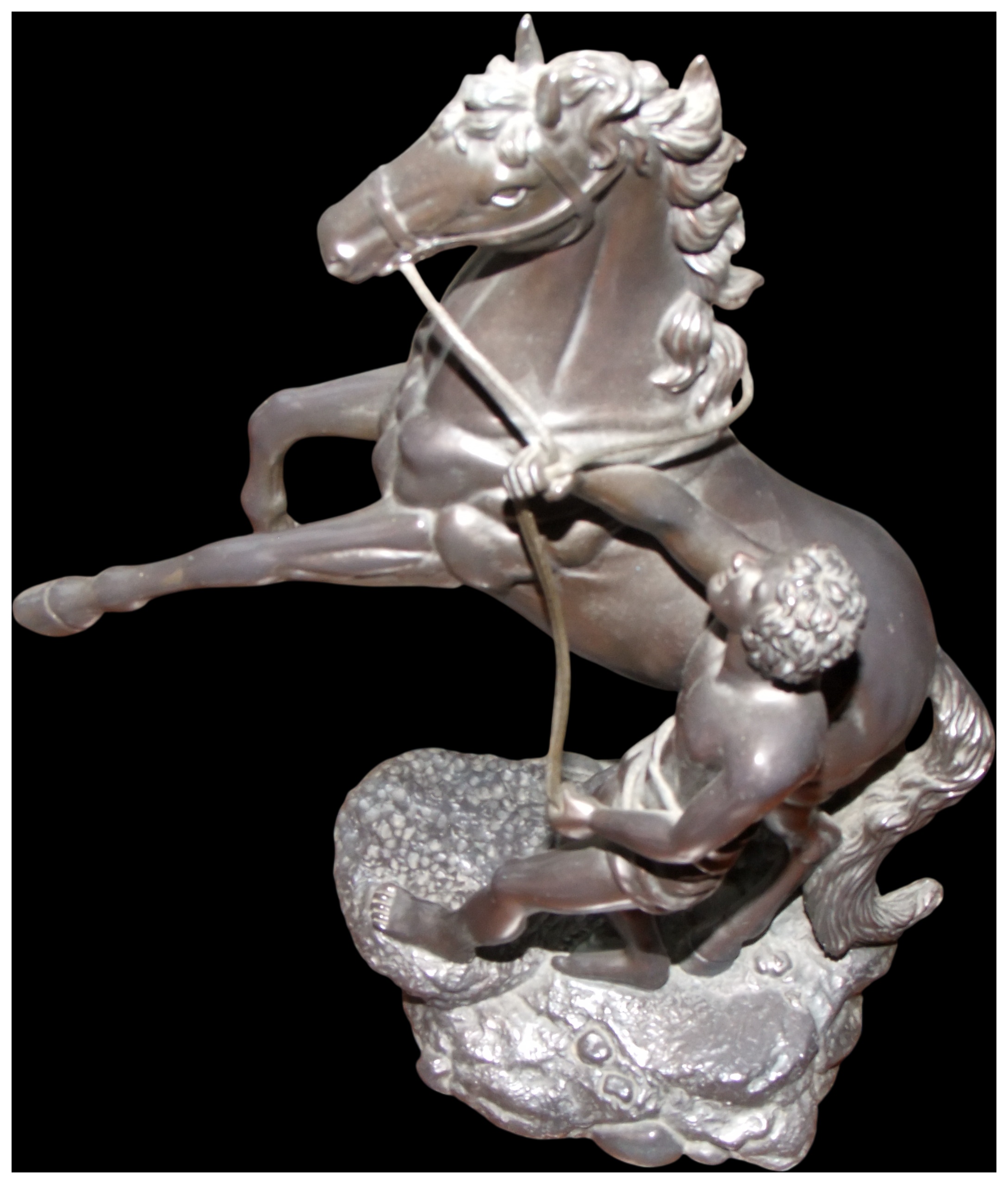 No reserve.A cast metal sculpture of a rearing horse and groom
