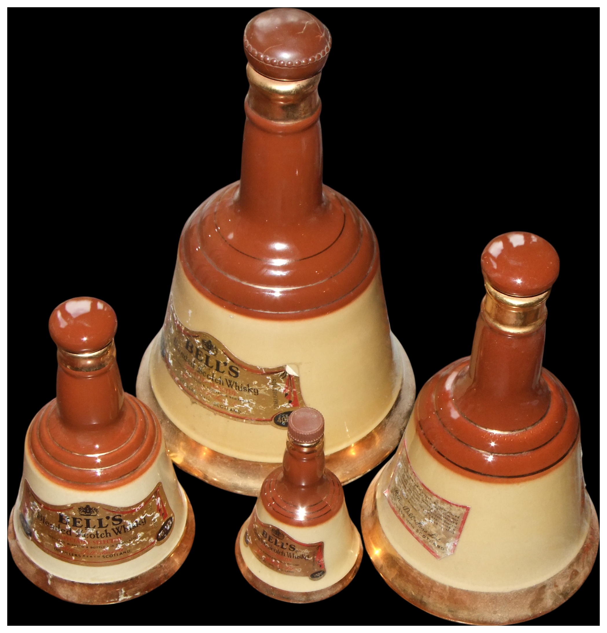 No Reserve, cannot post.A Set of Four Graduated Bell's Blended Scotch Whisky Ceramic Decanters