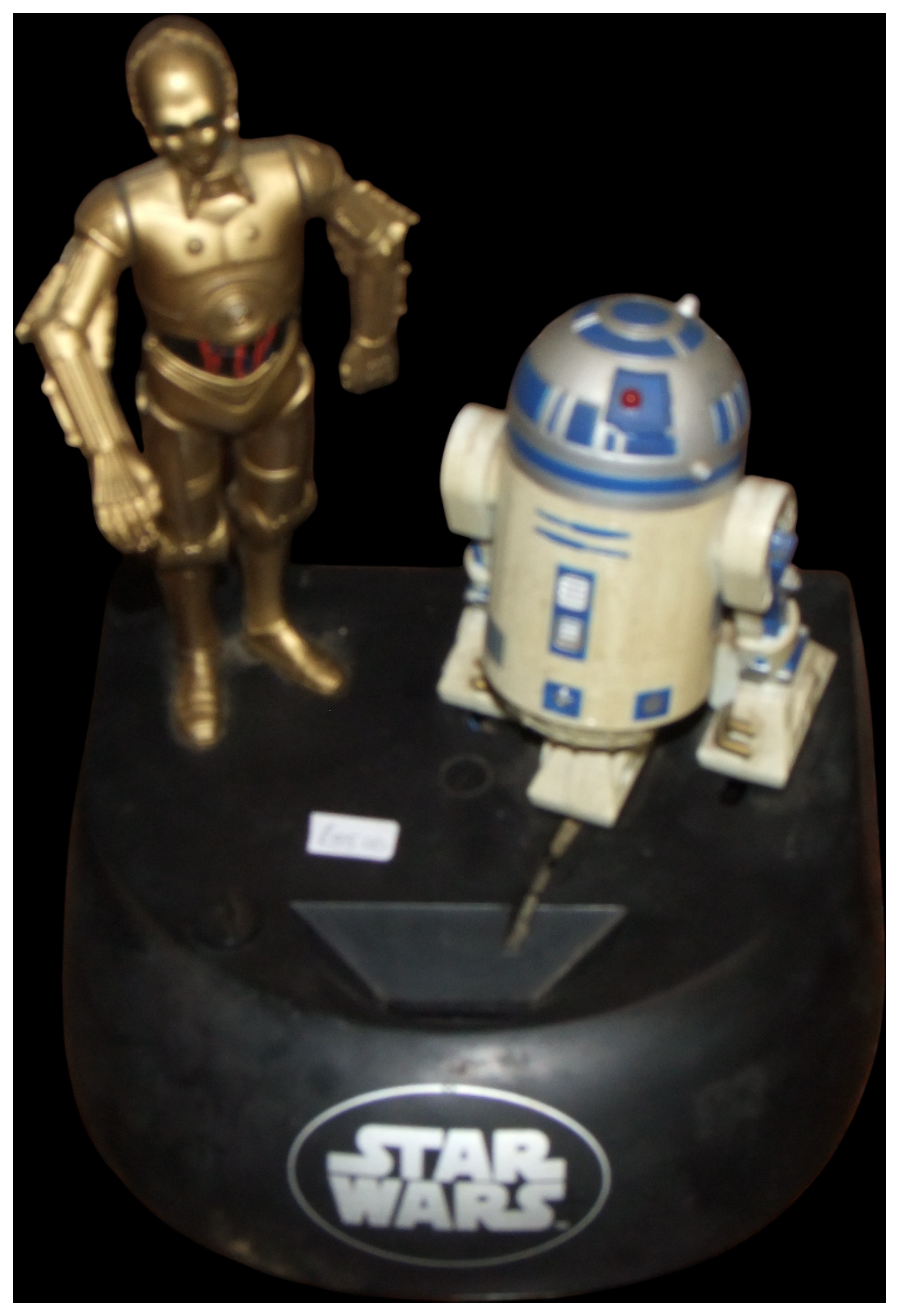 A Star Wars C-3PO and R2-D2 Electronic Talking Action Bank. No reserve.