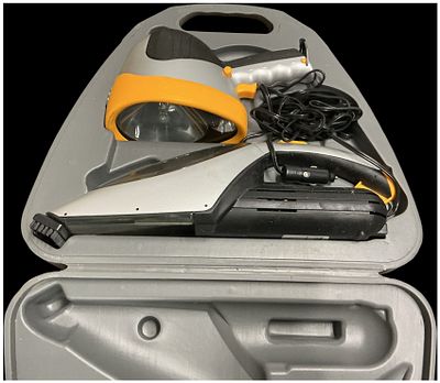 A 12V Automotive Accessory Kit with Spotlight and Vacuum Cleaner. A 12V automotive accessory kit 