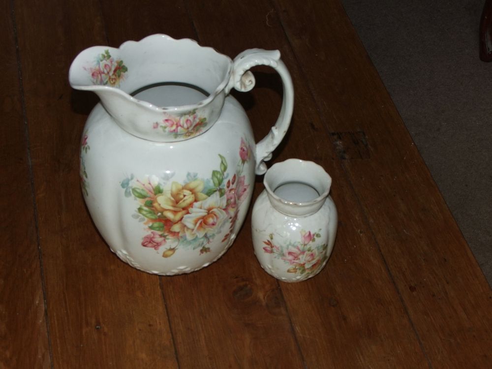 Lot 17: A Pair of Floral Pattern Ceramic Pitcher and Vase