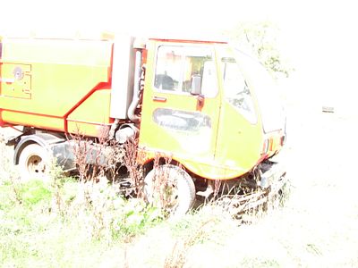 Commercial Road Sweeper Vehicle with Highway Maintenance Chevron Markings. A large commercial 