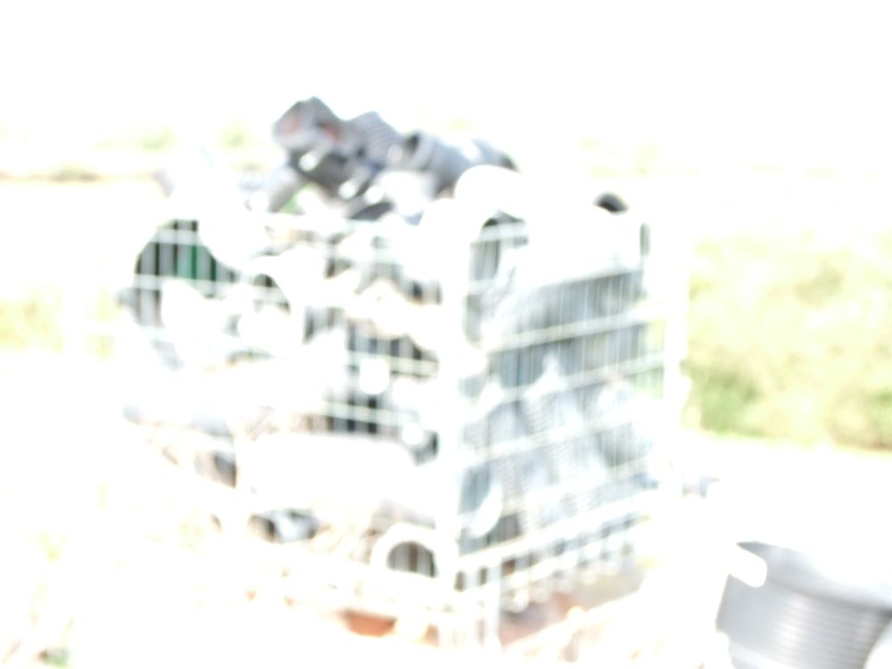 Lot 92: A Stacked Group of Wire Mesh Pallet Cages Containing Industrial Components