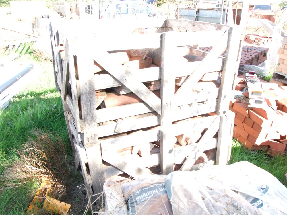 Lot 77: A Group of Reclaimed Terracotta Ridge Tiles in a Timber Crate