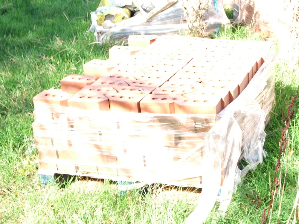 Lot 72: A Pallet of Perforated Red Clay Building Bricks
