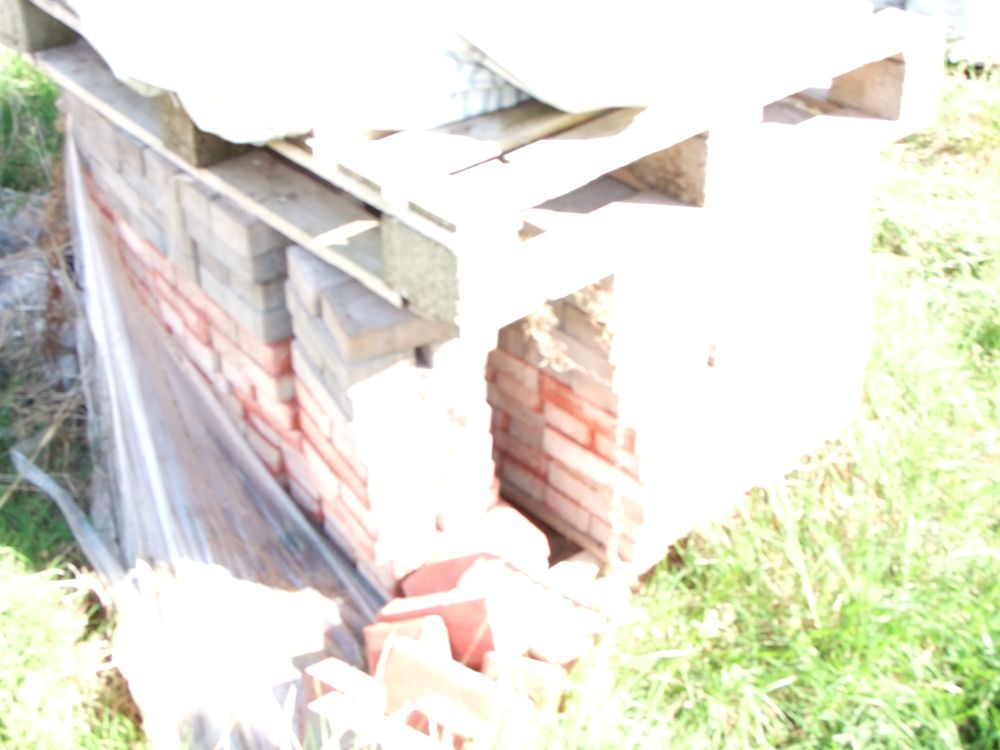 Lot 67: A Collection of Rectangular Paving Blocks and Clay Bricks on Wooden Pallets