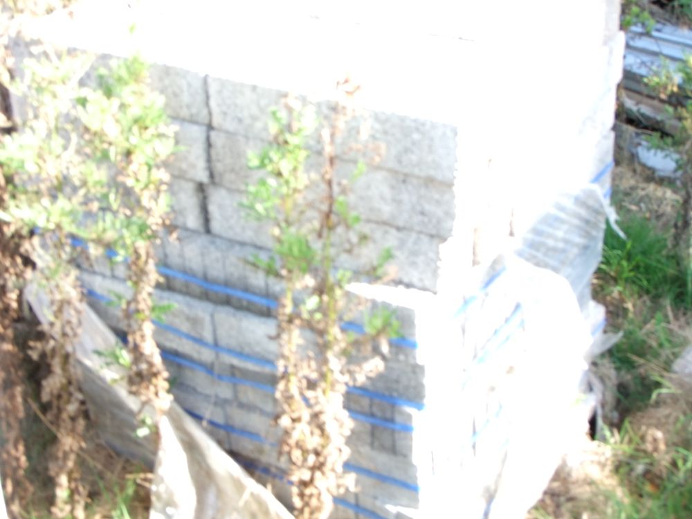 Lot 65: A Stack of Concrete Building Blocks Secured with Plastic Strapping