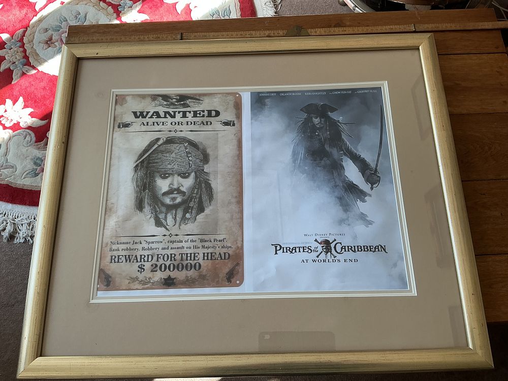 Lot 61: Large Framed Pirates of the Caribbean At World's End Promotional and Wanted Poster Display