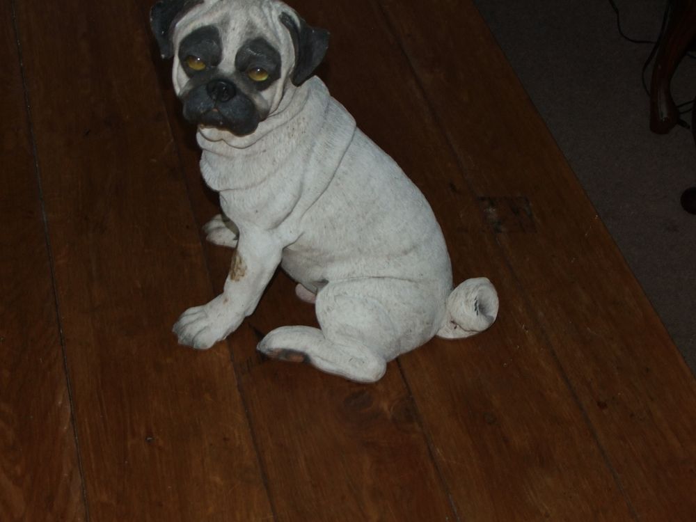 Lot 53: A life-sized cast composite figurine of a seated pug dog
