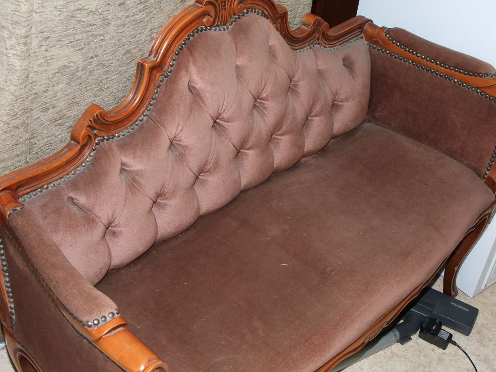 Lot 52: A Victorian style button back two seater settee
