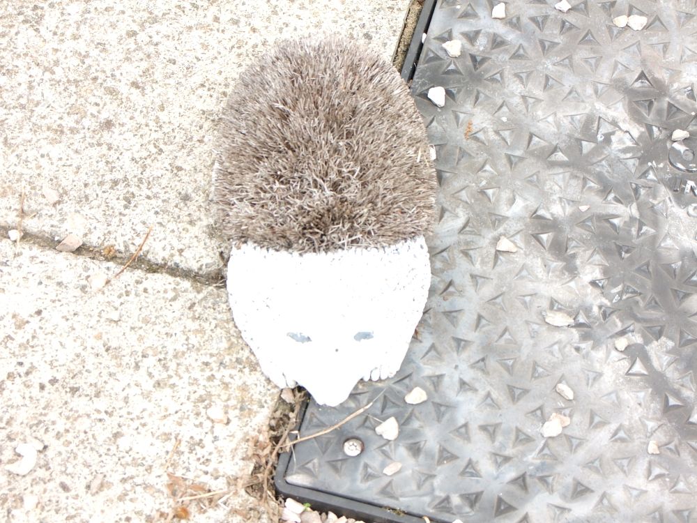 Lot 51: A cast stone and synthetic bristle hedgehog garden boot scraper