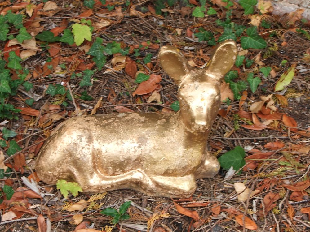 Lot 49: A gilded composite figure of a recumbent fawn