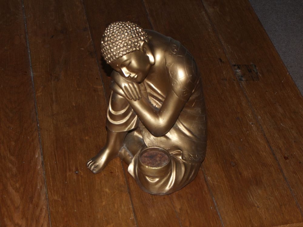 Lot 48: A contemporary metallic gold-toned composite sculpture of a Resting Buddha