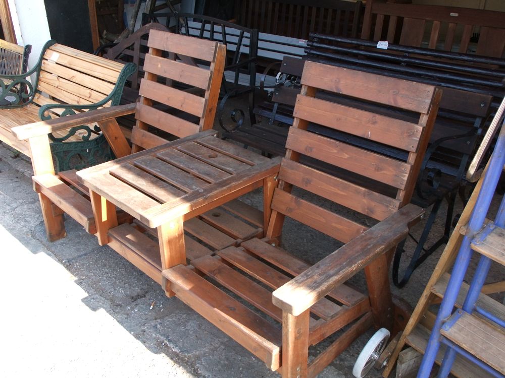 Lot 34: A wooden companion garden seat with integrated central table