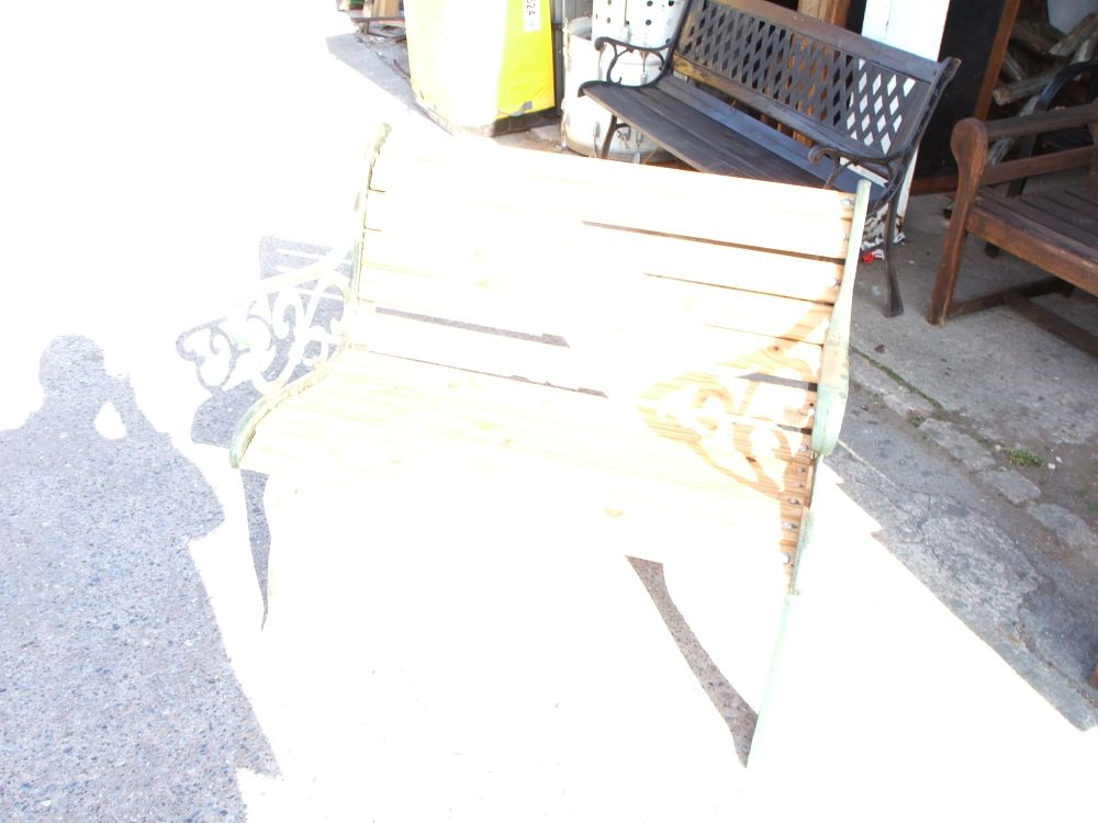 Lot 33: A Slatted Wood and Cast Iron Garden Bench