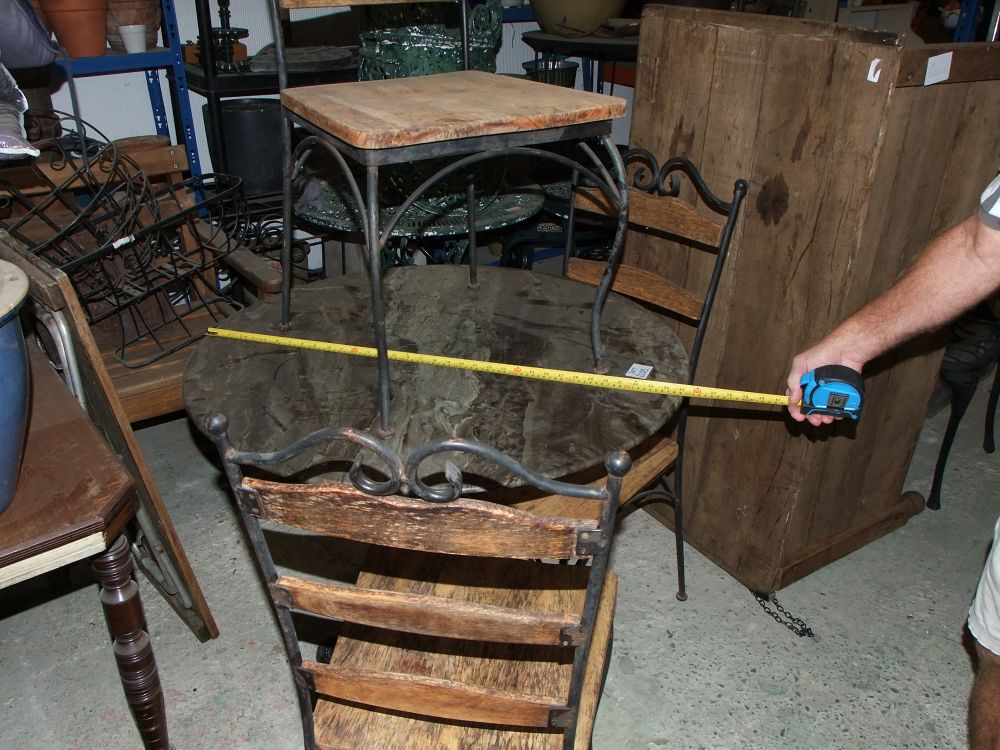 Lot 24: A Three Piece Wrought Iron and Natural Wood Bistro Set