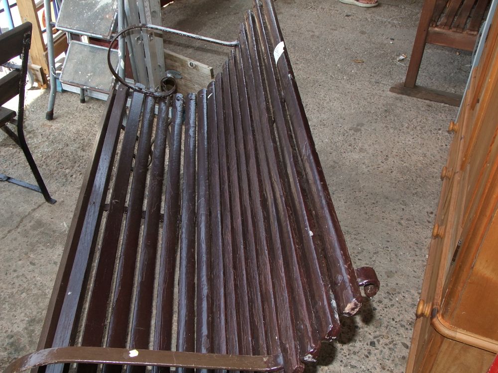 Lot 16: A Vintage Slat Back Wrought Iron and Wooden Garden Bench