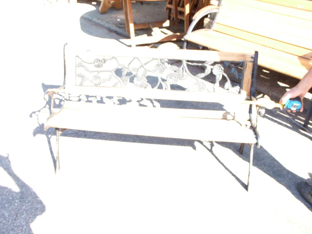 Lot 8: A Slatted Wood and Cast Metal Garden Bench with Rose Motif