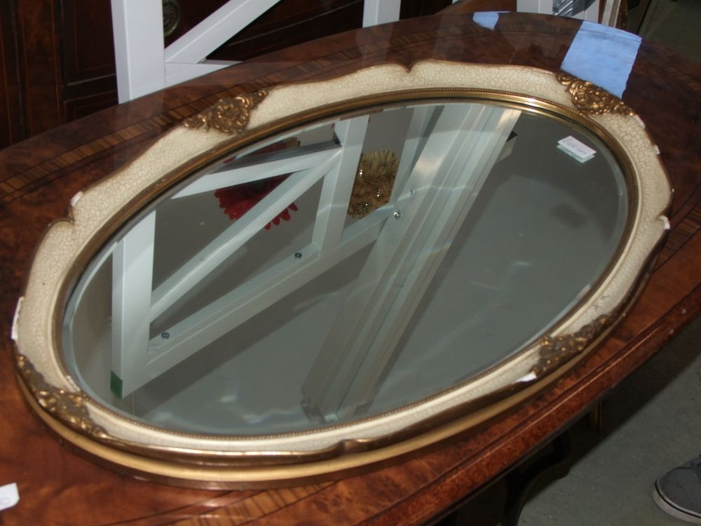 Lot 46: An Oval Gilt-Metal and Crackle-Effect Mirrored Vanity Mirror