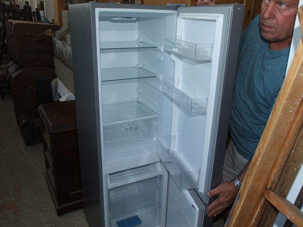 Lot 50: A Contemporary Silver-Tone Two-Door Fridge-Freezer