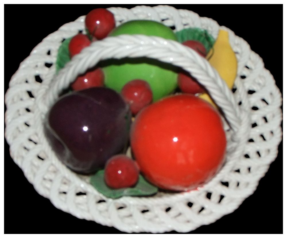 Lot 154: A polychrome glazed ceramic lattice weave fruit basket