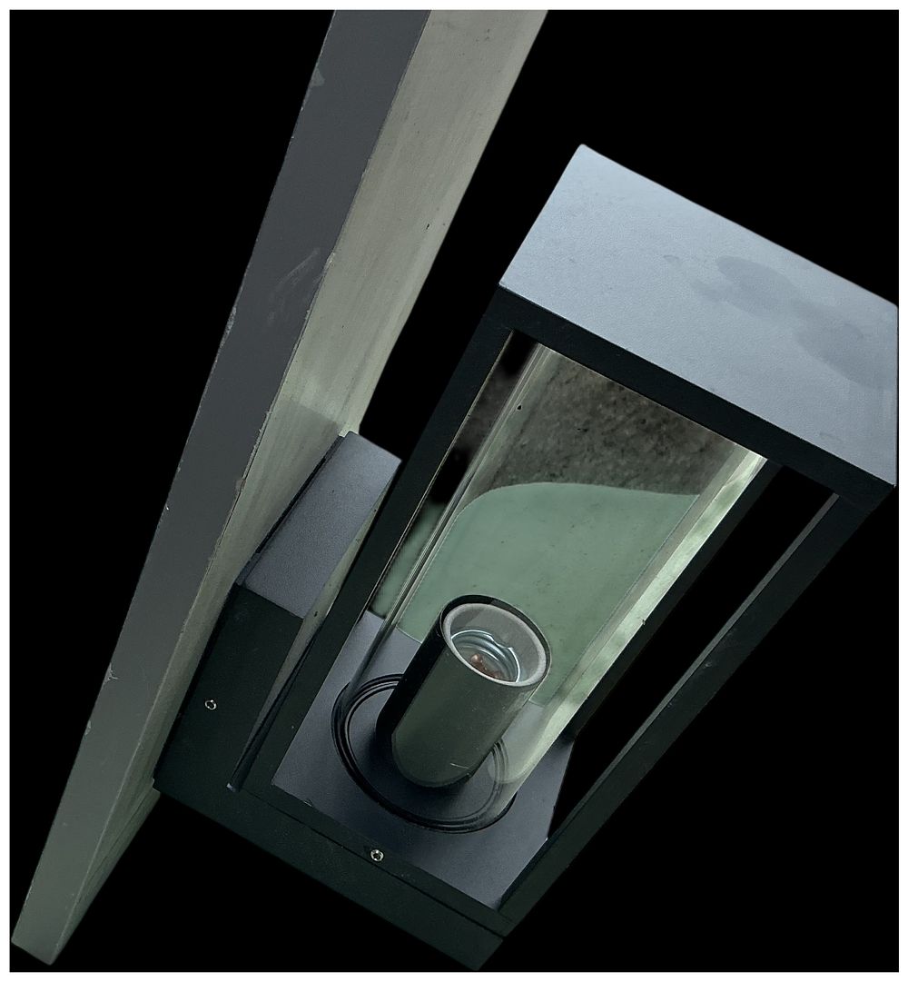 Lot 225: A Modern Minimalist Black Powder-Coated Metal and Glass Outdoor Wall Lantern