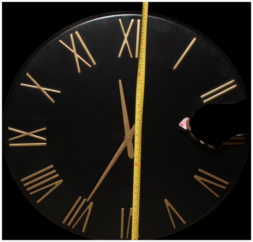 Lot 250: A Large Contemporary Black Metal Circular Wall Clock with Gold Tone Roman Numerals