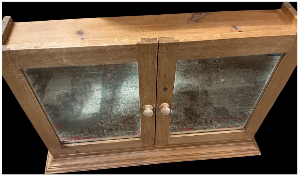 Lot 252: A contemporary pine two-door wall-mounted mirrored cabinet