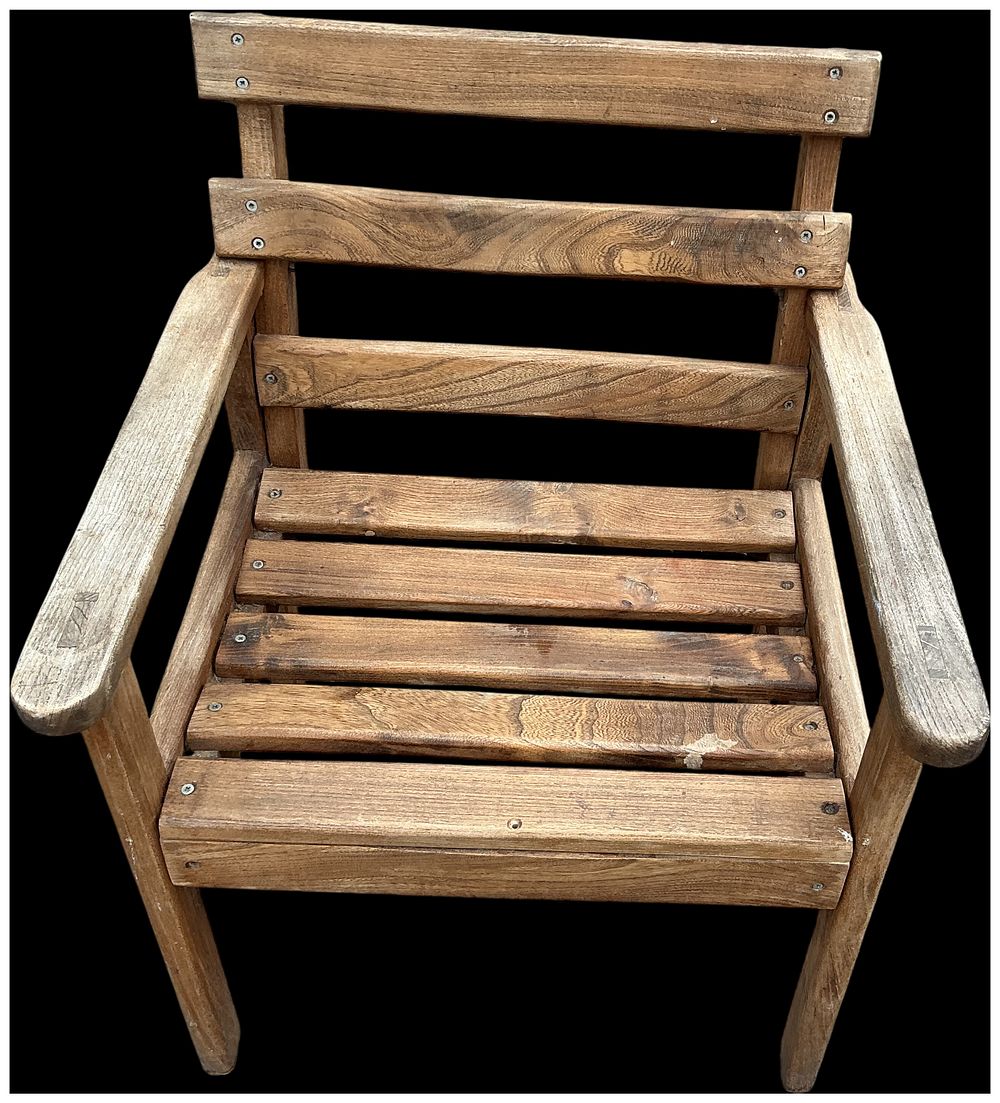 Lot 264: A weathered hardwood slatted garden armchair