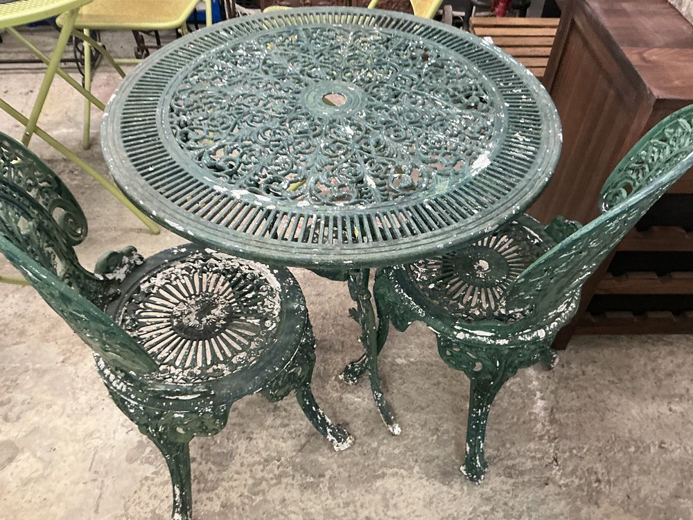Lot 324: A Victorian Style Three-Piece Cast Metal Garden Bistro Set
