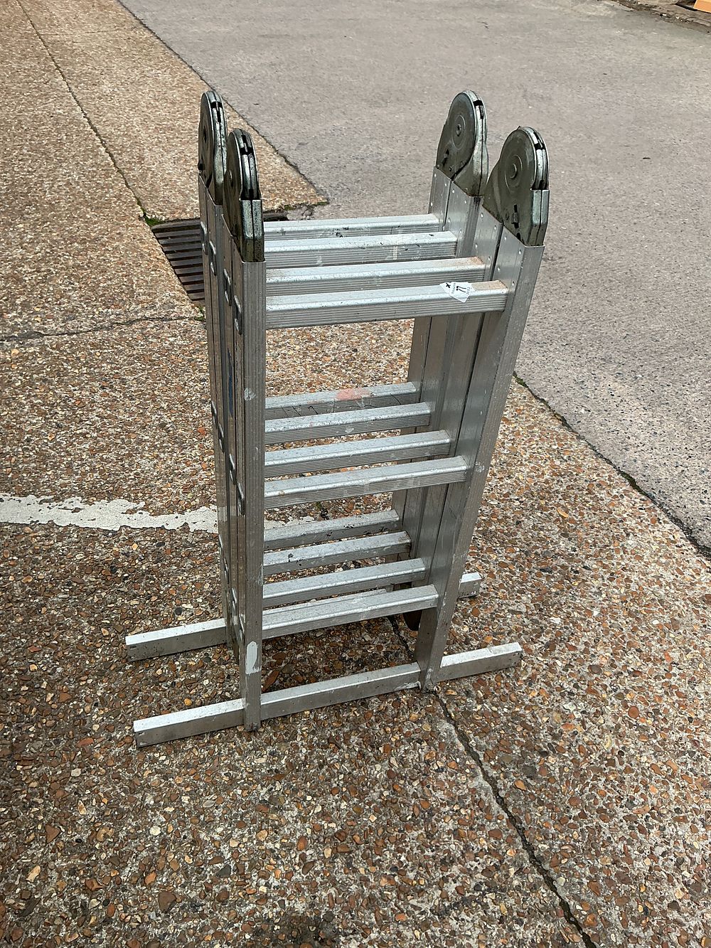 Lot 356: An aluminium multi-purpose articulating folding ladder