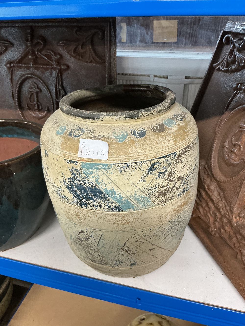 Lot 391: A rustic banded stoneware jar with incised chevron decoration