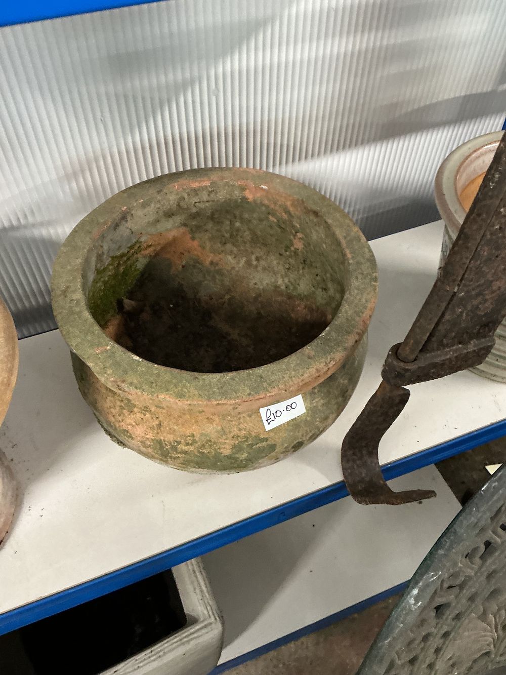 Lot 400: A weathered earthenware garden planter or shallow crock