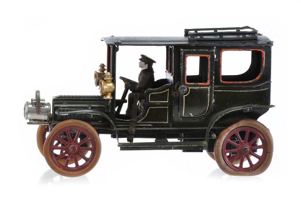 Lot 175: Dark Green Hand Painted Carette Tin Limousine