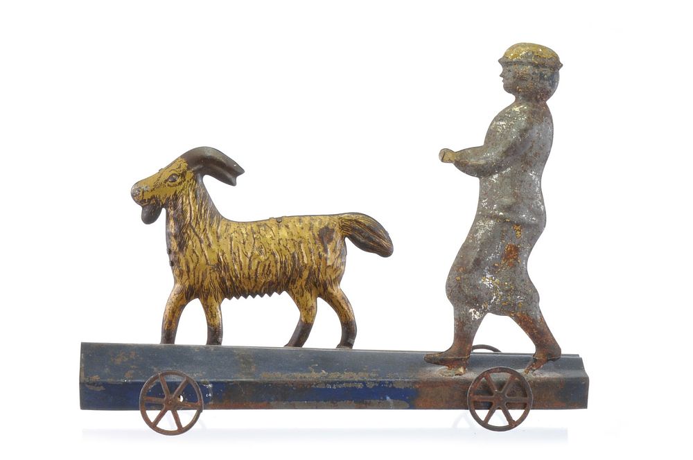 Lot 227: Tin Goat with Walking Herder, Likely Fallows