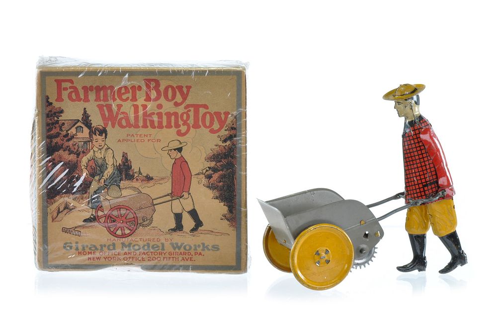 Lot 245: Boxed Farmer Boy Walking Toy by Girard Tin Model Works
