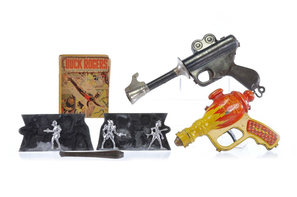 Lot 249: Buck Rogers Space Toy Lot with Daisy Gun & Water Pistol, Lead Figure Mold, and Book