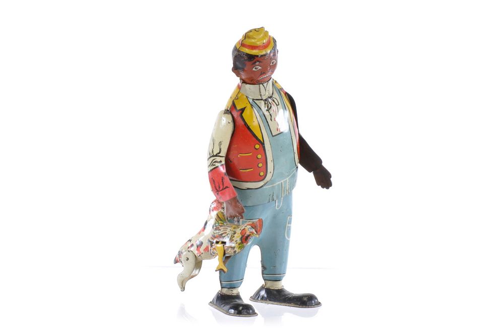 Lot 259: Marx Chicken Snatcher Tin Windup with Dog