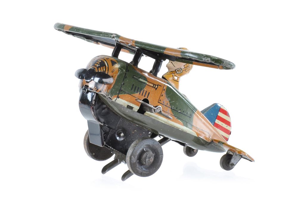 Lot 278: Marx Rollover Plane in Camo with Tin Driver